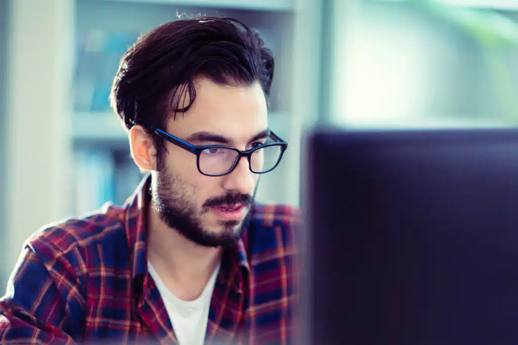 Smart Web Creative - Best WordPress Hosting in Los Angeles: Reliable Solutions for Local Businesses - man in front of computer doing web maintenance